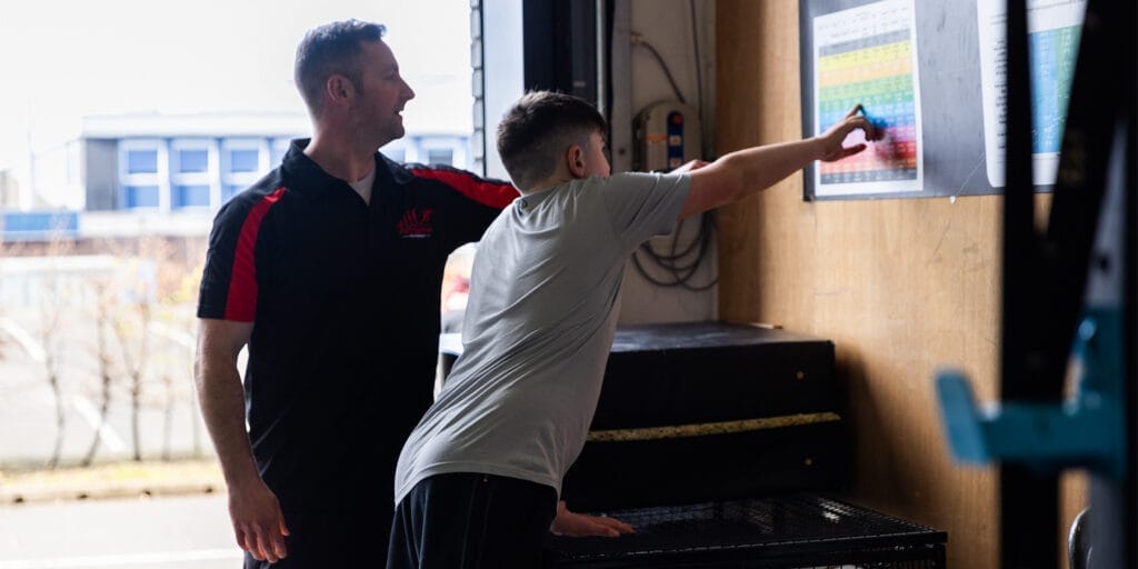 Kid training with his personal trainer at The Athlete Academy