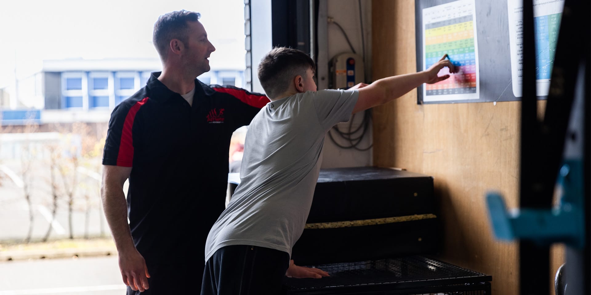 Kid training with his personal trainer at The Athlete Academy