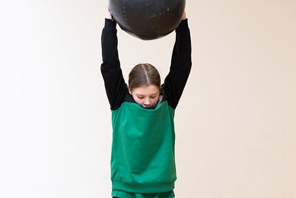 kid exercising from home thanks to The Athlete Academy