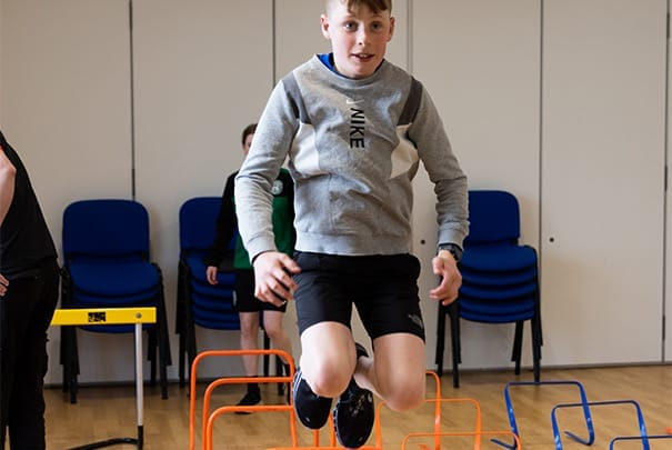 kid jumping and training at The Athlete Academy
